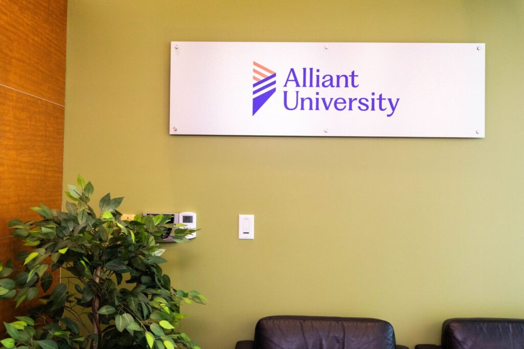 Alliant University sign on a wall on the Sacramento campus