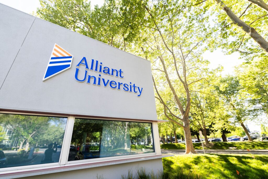 A building with a sign on it with the Alliant University logo