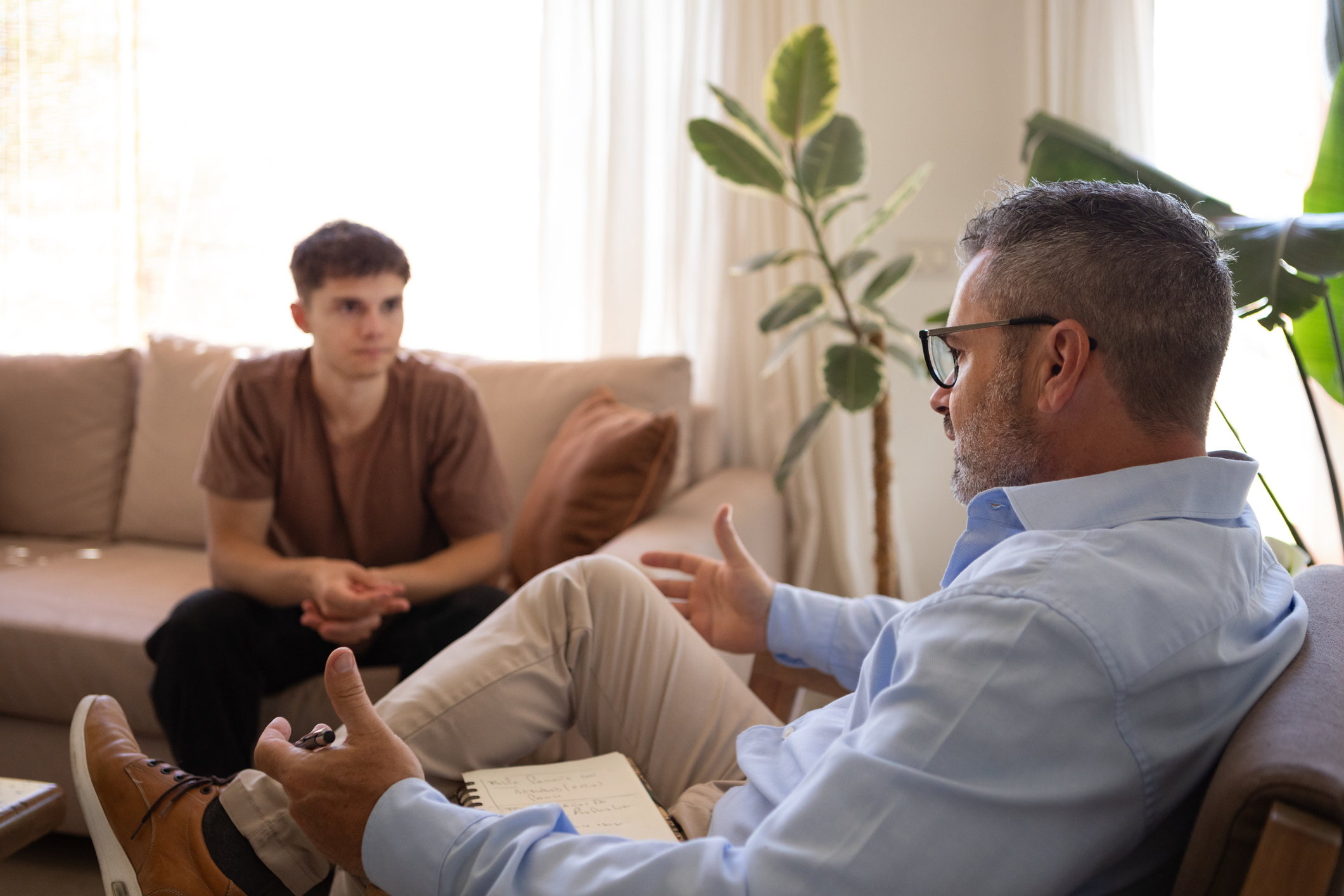 therapist talking with patient