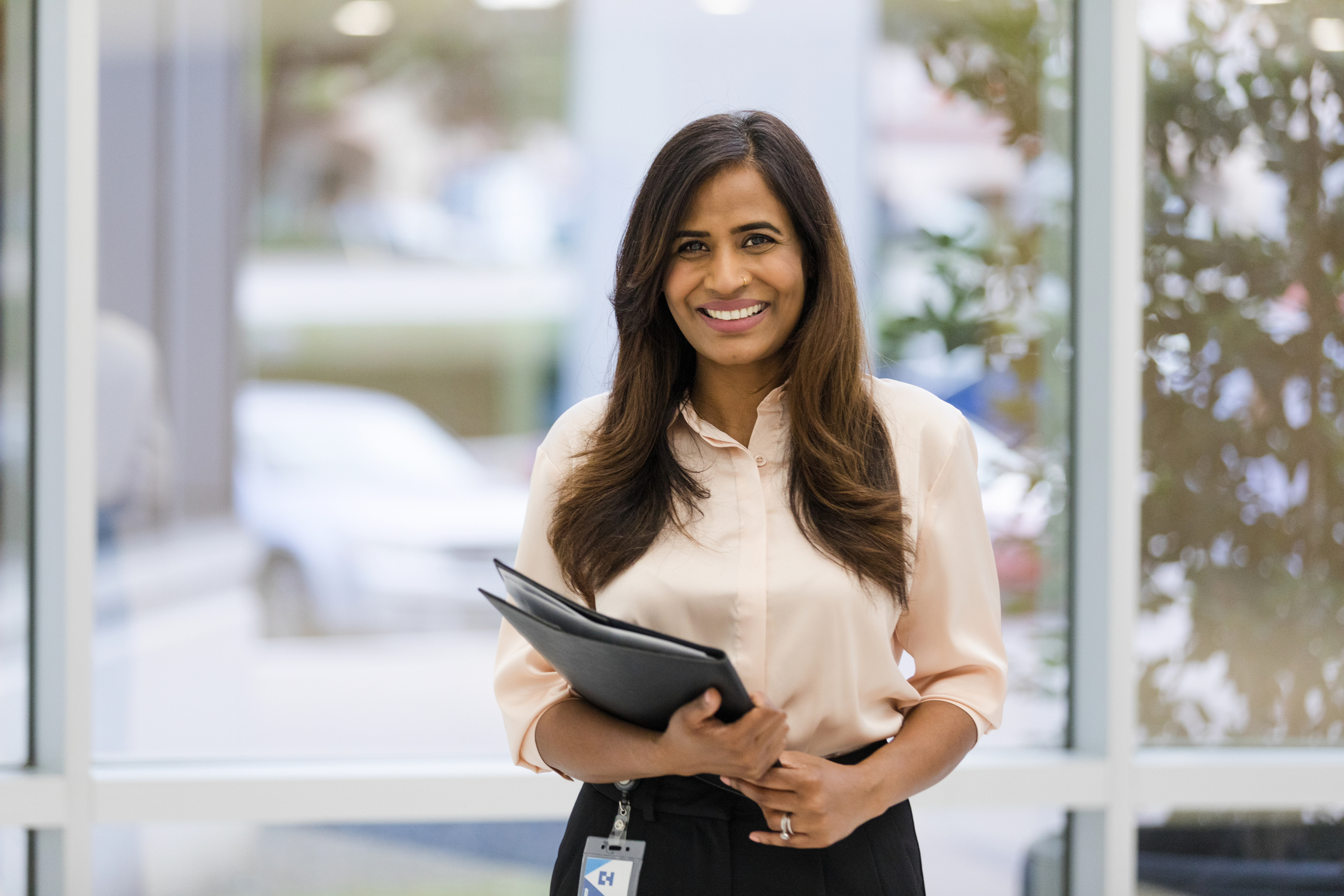 Beautiful female surgeon smiles for the camera