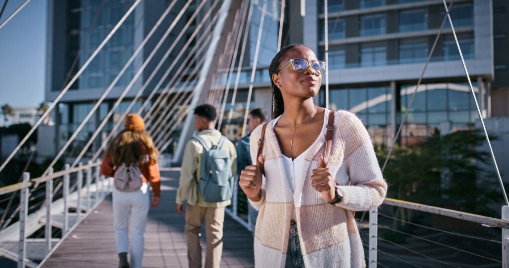 Student, education and thinking with woman and walking for learning, future and knowledge. University, inspiration and youth development with person at college for scholarship, vision and studying