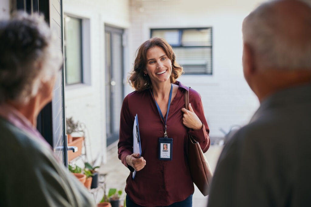 Mid adult social worker visiting an elderly couple at home