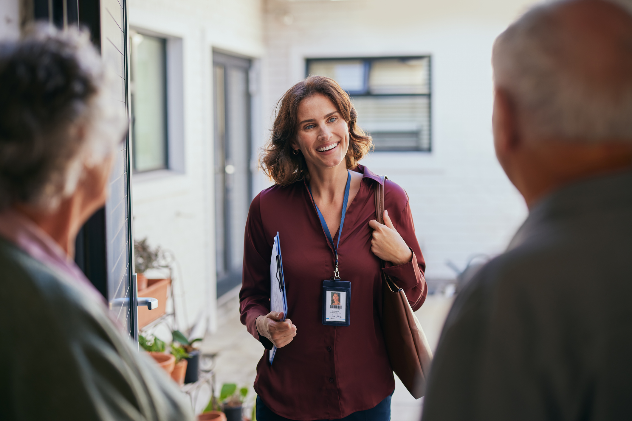 Mid adult social worker visiting an elderly couple at home