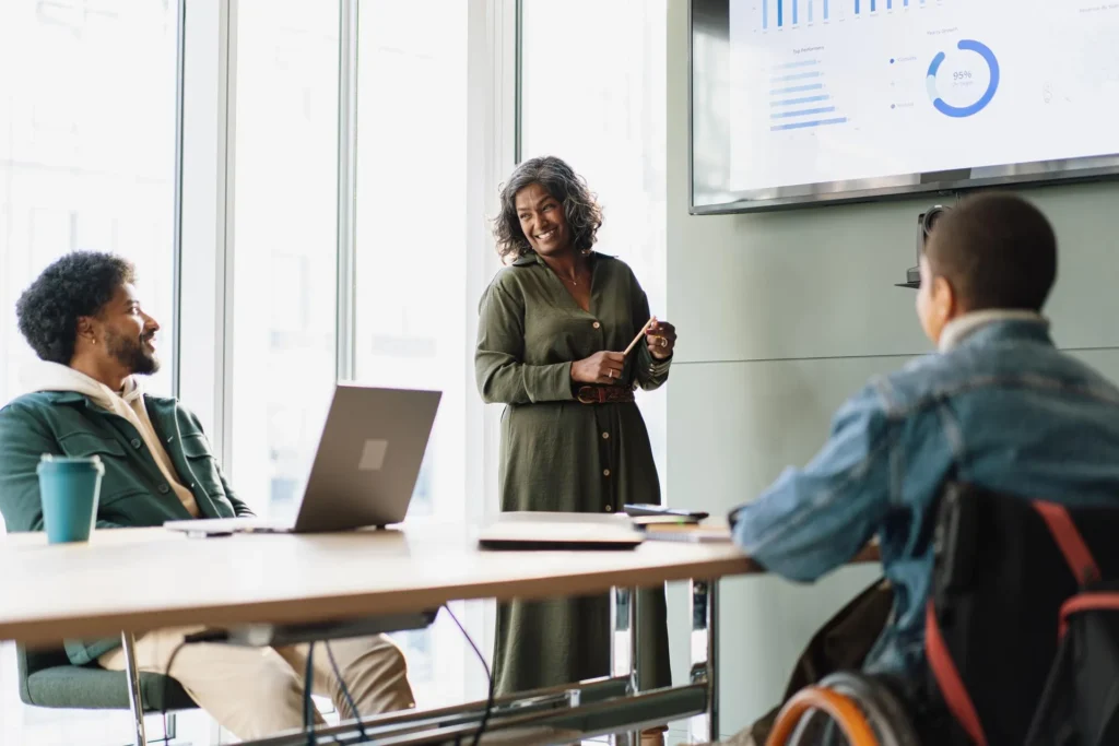 A woman standing in front of a window