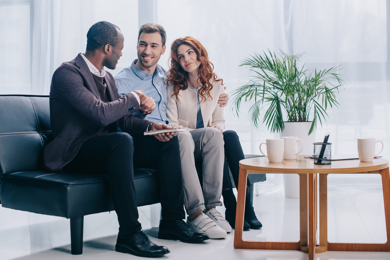 A group of people sitting on a couch