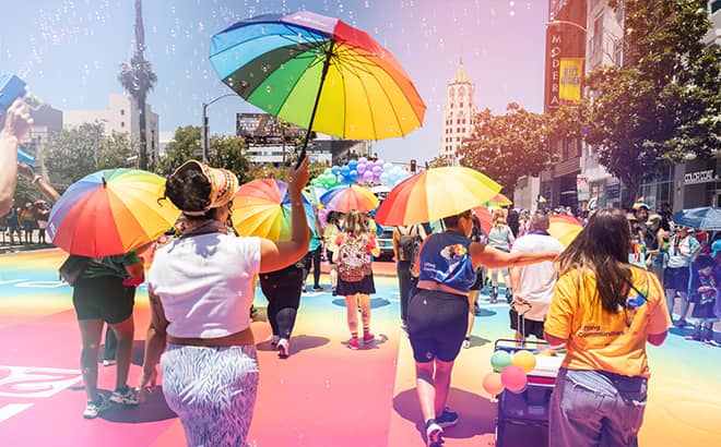 A group of people holding umbrellas